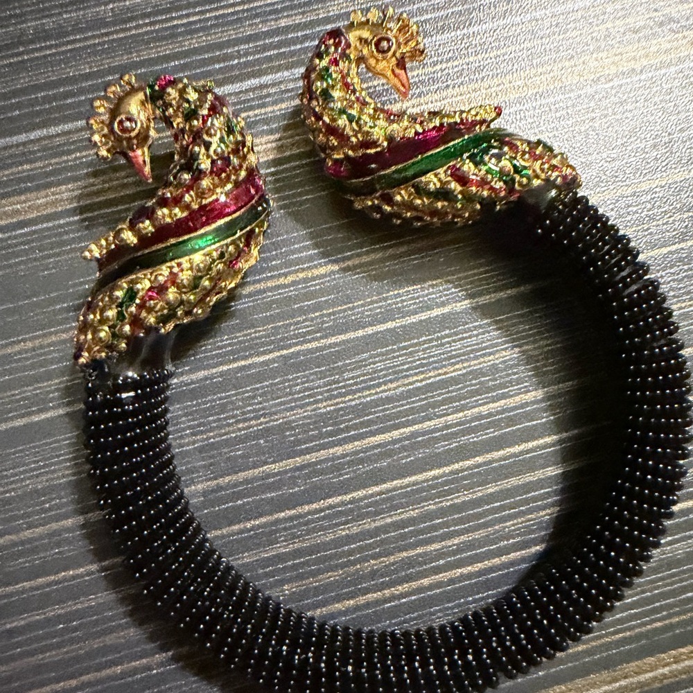 Elegant Gold and Black Peacock Bracelet